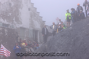 Fans waiting in the fog at the top of the Tourmalet