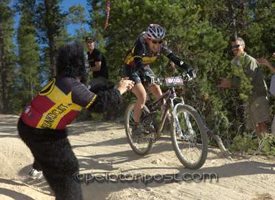 Fan in gorilla suit cheering riders