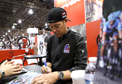 Tom Danielson signing autographs for fans